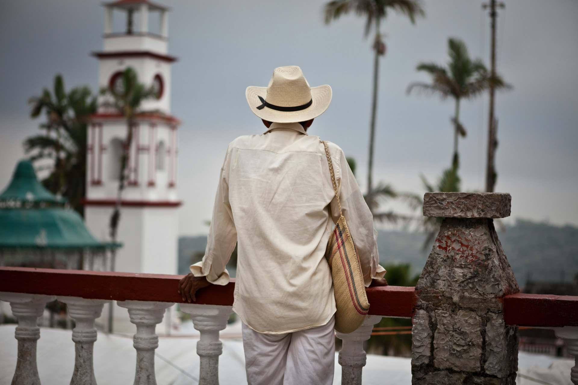 Man looking away in a balcony